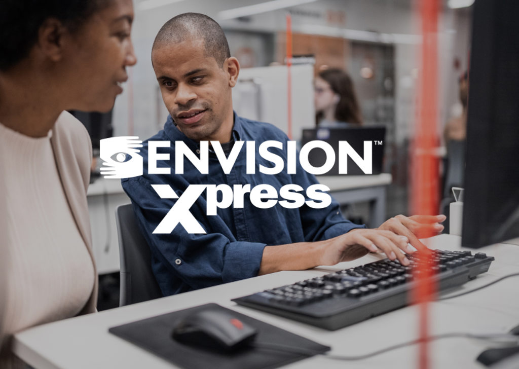 Man with vision impairment in an office and talking with a colleague. The Envision Xpress logo is on top of the image